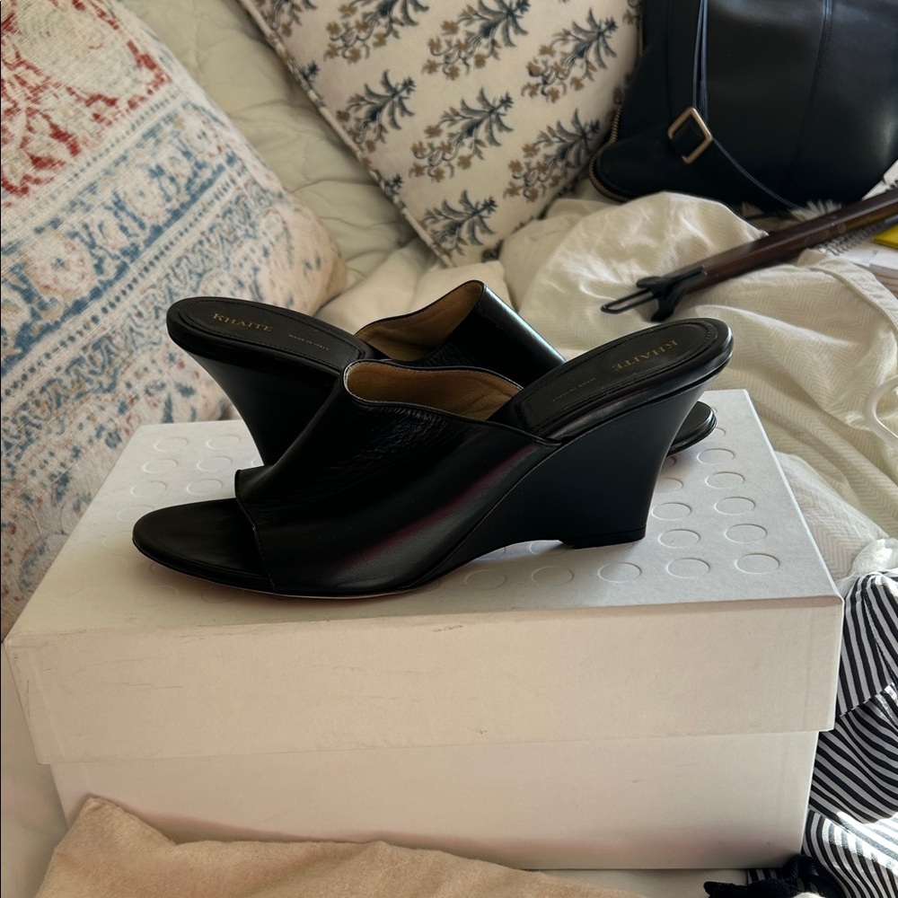 KHAITE Black Leather Wedge Slide Sandal